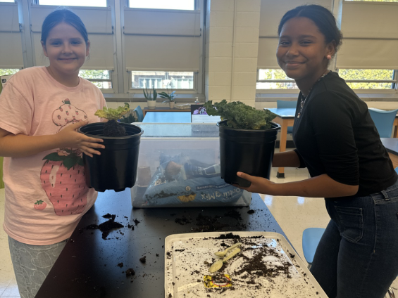 students potting plants